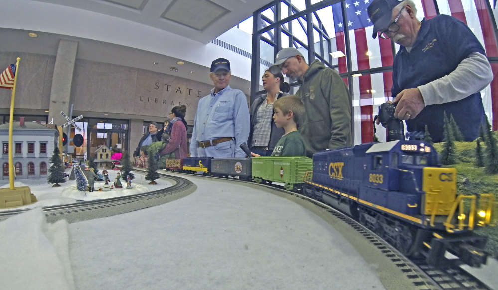 watch a Lionel O-gauge train display during the Maine State Museum 