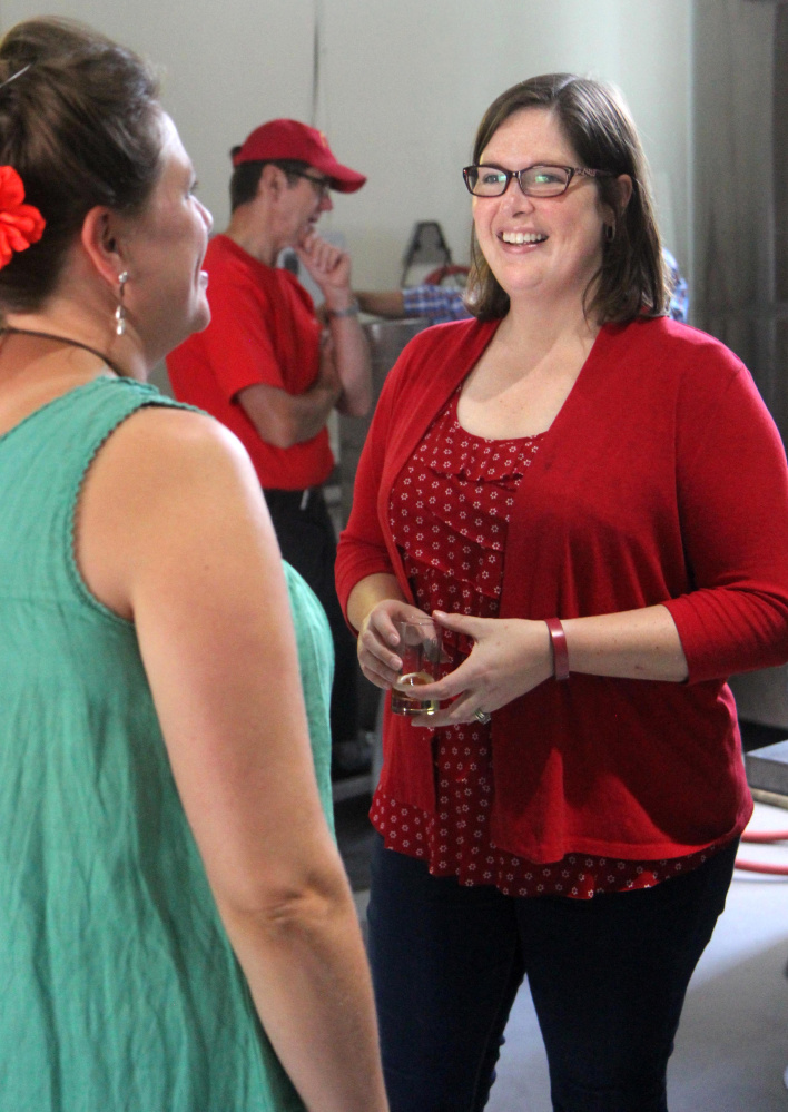 Democrat Emily Cain chats with Norway Brewing Co. co-owner Erika Melhus while campaigning Aug. 26 in Oxford County.